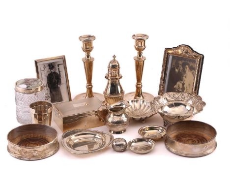 A small collection of silver items including:Pair of candlesticks, weighted bases, Birmingham 1980, 20cms highBritannia stand