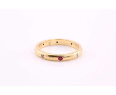 A Theo Fennel ruby and diamond set wedding band, consisting of four rubies and four diamonds, flush set around a yellow gold 