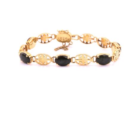 A jade link bracelet, the oval jade panels alternating with yellow precious metal pierced longevity motif - Chinese character