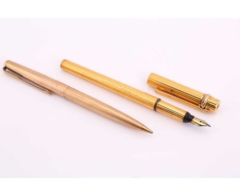A Cartier fountain pen and Parker mechanical pencil. The Cartier 'Must de Cartier' fountain pen, has a ribbed barrel with tri
