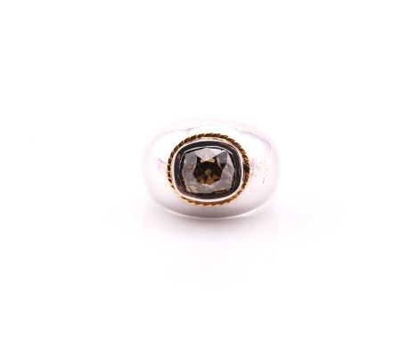 A single stone brown diamond ring, the cushion cut diamond collet set in white, with a yellow ropetwist collar, and white tap