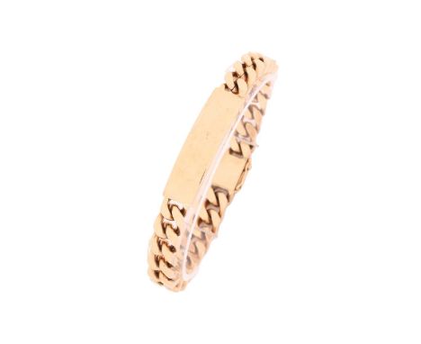 A 9ct gold ID bracelet, consisting of a square curb chain attaching a curved ID tag, fastened with lever clasp and figure of 