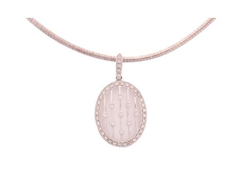 A diamond pendant on silver chain, consisting of an oval pendant with nine round diamonds collet set in the centre and encomp