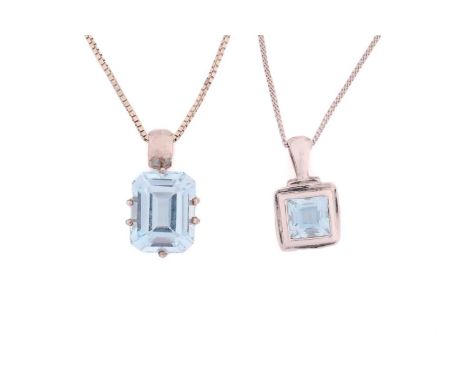 A lot consisting of two topaz necklaces, one has an emerald-cut 9.9 x 7.9 mm blue topaz, claw set on a 9ct white gold mount w