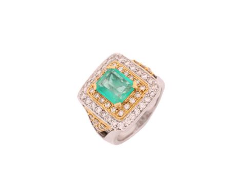 An emerald and diamond three-tier dress ring, consisting of a central emerald-cut emerald, approximately measuring 9.5 x 7.8 