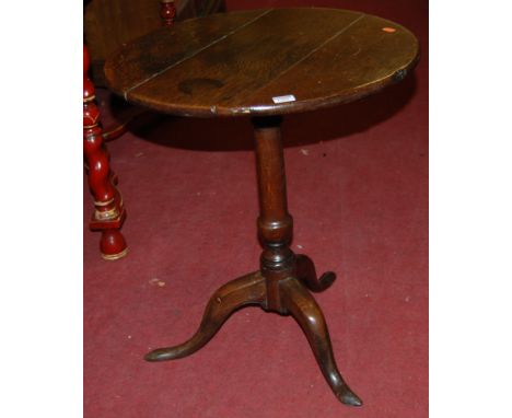 A 19th century plank top oak circular pedestal tripod table, dia. 57cm