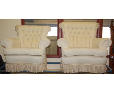 A contemporary cream floral upholstered buttonback three-piece suite, comprising three-seater sofa, gentleman's armchair and 