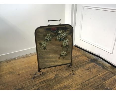 A Victorian brass painted mirror back firescreen raised on shaped supports (one pad foot missing) (h.62cm x 41cm)