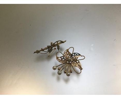 A yellow metal openwork spiral brooch mounted seed pearls and an Edwardian yellow metal seed pearl mounted bar brooch complet