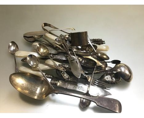 A collection of Epns including mother of pearl fish knives and forks, sugar tongs, apostle spoons, a silver napkin ring by Ha