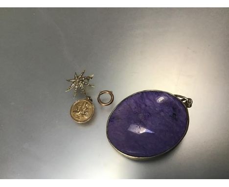 A yellow metal zodiac sign, a yellow metal fastening, an Edwardian 9ct gold seed pearl mounted brooch and a yellow metal moun