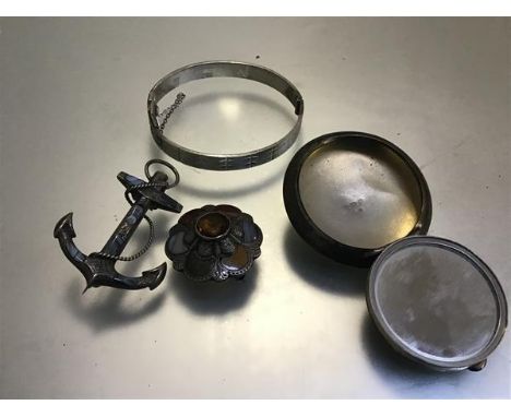 A Victorian white metal anchor and rope hardstone mounted brooch (6cm), a silver hatched bangle (6cm), a Victorian white meta