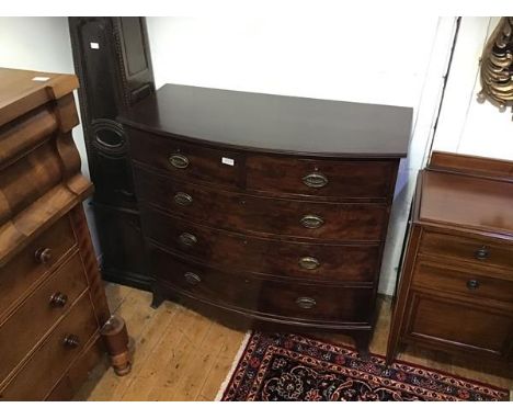 A 19thc mahogany bow front chest, the top with reeded edge above two short and three graduated long drawers, with shaped apro