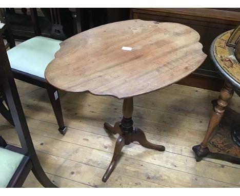 A 19thc mahogany shaped top occasional table raised on turned column and tripod support (h.70cm x 71cm x 50cm) (top a/f)