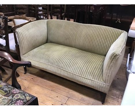 An Edwardian mahogany club style two seater sofa with upholstered panel back, arms and seat, in striped gold velour, on squar