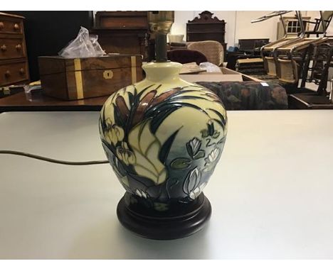 A Moorcroft pottery baluster table lamp decorated with water lily and iris design, yellow ground (lamp including base: 21cm)