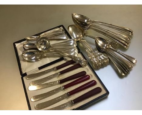 A set of six Epns tea knives with red handles, a part set of Epns bead pattern table spoons, dessert spoons and teaspoons wit