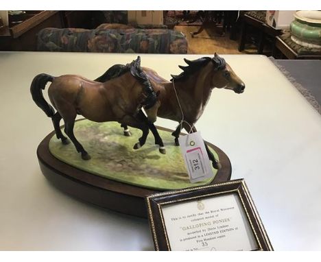 A Royal Worcester limited edition porcelain model group, Galloping Ponies, modelled by Doris Lindner, mounted on wooden stand