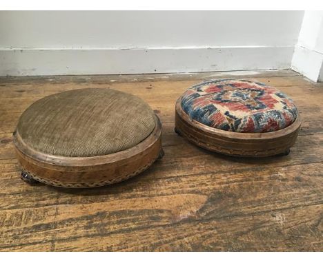 Two Victorian walnut inlaid circular footrests with upholstered tops on ceramic fluted supports (h.10cm x d.26cm)