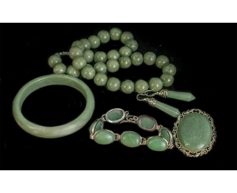Jade Suite comprising beaded necklace, bracelet set in white metal, oval brooch, bangle and a pair of drop earrings set in wh