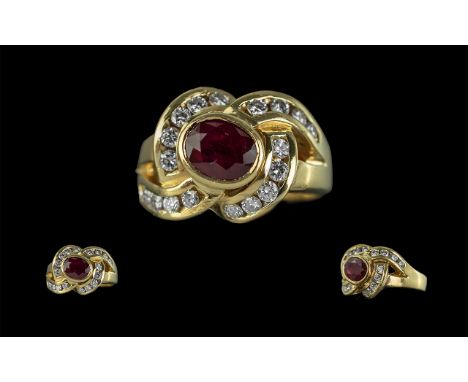 18ct Yellow Gold Designer Diamond and Ruby Set Dress Ring, marked 18ct to shank, the centre ruby surrounded by twenty excelle