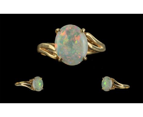 Ladies Attractive 9ct Gold Single Stone Opal Set Ring, Gold Marks to Shank, The Oval Shaped Opal of Good Colours, Est 2.00 ct