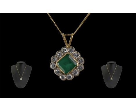 A Superb 18ct Gold Diamond and Emerald Set Pendant - Attached to a 18ct Gold Chain. Both Marked 750 - 18ct. The Step-cut Emer