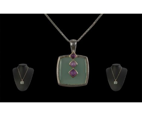 Attractive Oriental Silver Pendant, square form with jade green centre stone and three pale amethyst colour stones below the 