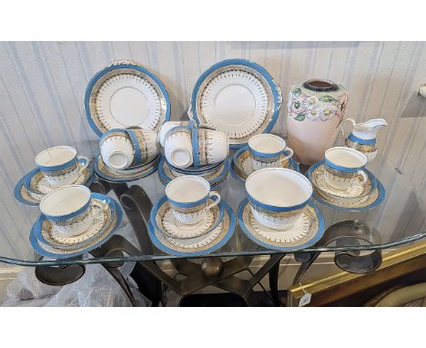 Vintage China Tea Service, white porcelain decorated with azure blue and gilt pattern, 12 piece setting comprising cups, sauc