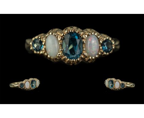 Ladies 9ct Gold Attractive and Pleasing Design Five Stone Opal and Blue Topaz Set Ring, with full hallmark to shank, the ston