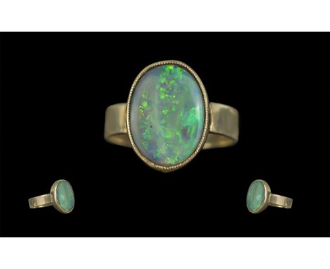 Antique Period - Attractive 9ct Gold Single Stone Opal Set Ring. Marked 9ct. The Large Oval Shaped Opal of Good Colours, Est 