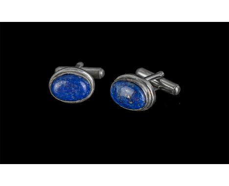 Pair of Gentleman's Lapis Lazuli Cufflinks, oval stone set in white metal.