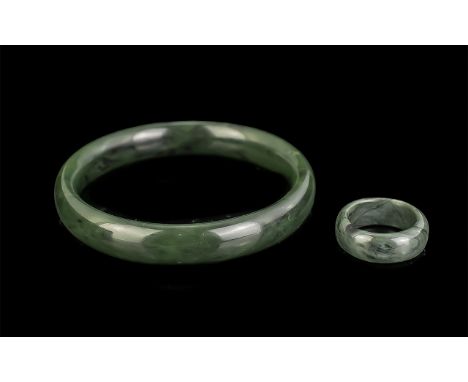 Nephrite Bangle and Matching Band Ring, a full circle spinach jade bangle, carved from a solid nephrite piece; of large size,