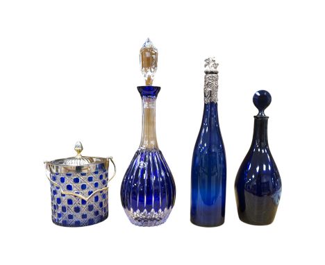 A collection of blue glassware comprising a late 18th century Bristol blue glass decanter and tear drop stopper, 30cm, a mid 