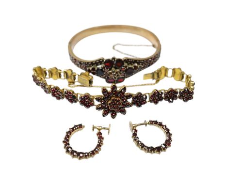 Three items of gilt white metal and garnet paste cluster set jewellery, comprising a bracelet, bangle and pair of Czechoslova