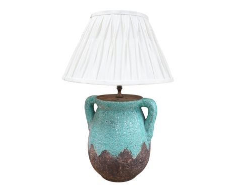 A turquoise lava ceramic table lamp with fabric shade, wired, 61cm to top of shade, 33cm high excluding the fitting and shade