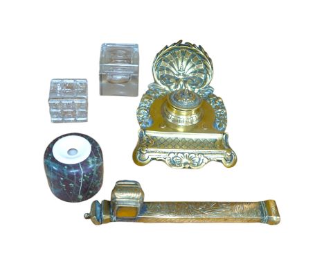 A 19th century Persian brass scribe set, a cast brass inkwell, three other inkwells, largest 24cm in length (5) Condition - p