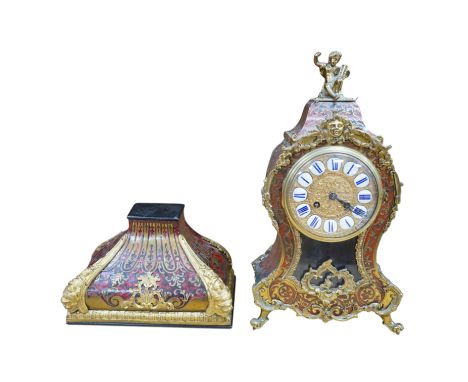 A French scarlet Boulle clock, and original bracket, the waisted case with glass front enclosing boulle interior and sunburst