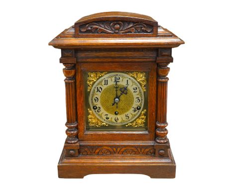 A late 19th century German oak three train mantel clock, 38.5cm high. Condition - fair, untested