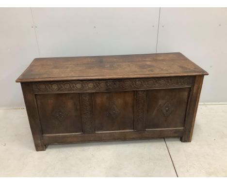 An 18th century carved oak coffer, width 141cm, depth 53cm, height 68cm. Condition - fair