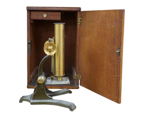 A Victorian brass microscope, J T Slugg, Manchester, in original wooden case, with a small selection of slides. Condition - f