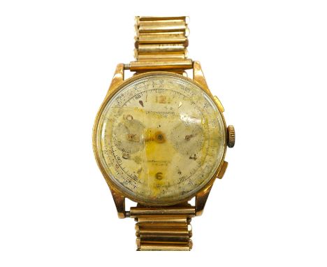 A gentleman's yellow metal Swiss chronograph manual wind wrist watch (lacking back cover), on a gold plated strap. Condition 