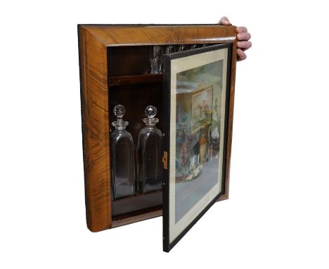 Asprey of London, a cushion-moulded walnut decanter wall cabinet, chromolithograph enclosing four cut glass decanters and six