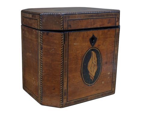 A George III Sheraton period octagonal West Indian satinwood and marquetry tea caddy, 12cm high. Condition - fair