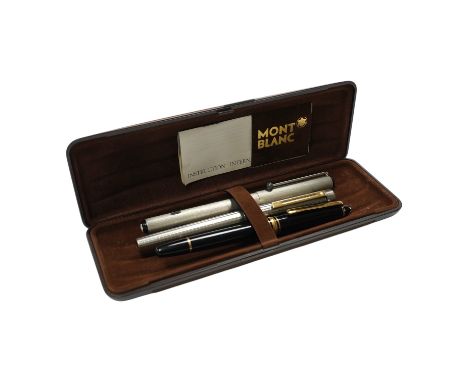 Two Montblanc fountain pens and a Sheaffer fountain pen, in a Montblanc case. Condition - fair to good