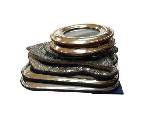 Three assorted modern embossed silver mounted shaped photograph frames, largest 32.8cm, together with a large pair of Italian