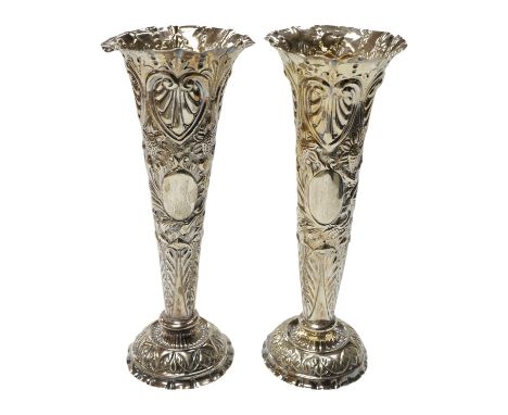 A pair of late Victorian repousse silver trumpet vase, Charles Boyton II, London, 1892/3, 20.3cm, weighted. Condition - poor