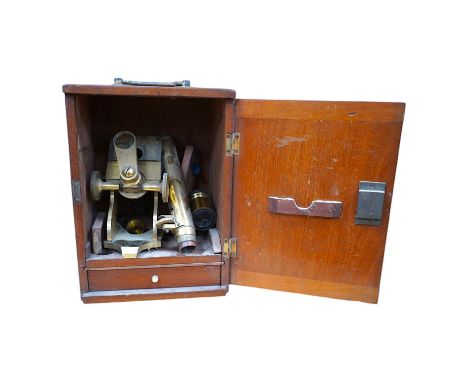 A mahogany cased late 19th century brass microscope by J.H. Steward, 456 West Strand London, with a drawer underneath contain