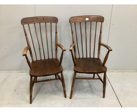 A pair of mid 19th century ash, elm and beech Windsor comb back armchairs, width 52cm, depth 44cm, height 105cm. Condition - 