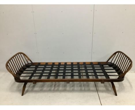 An Ercol day settee, width 208cm, depth 73cm, height 70cm. Condition - fair but missing bolts for side rail